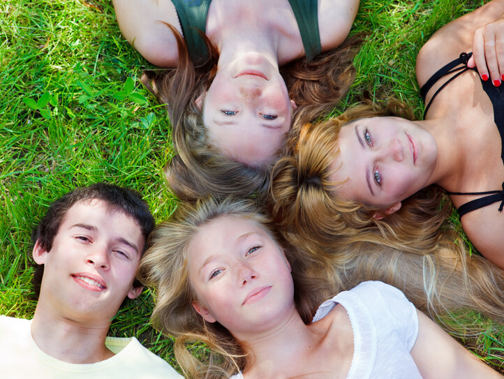 Students lying on grass